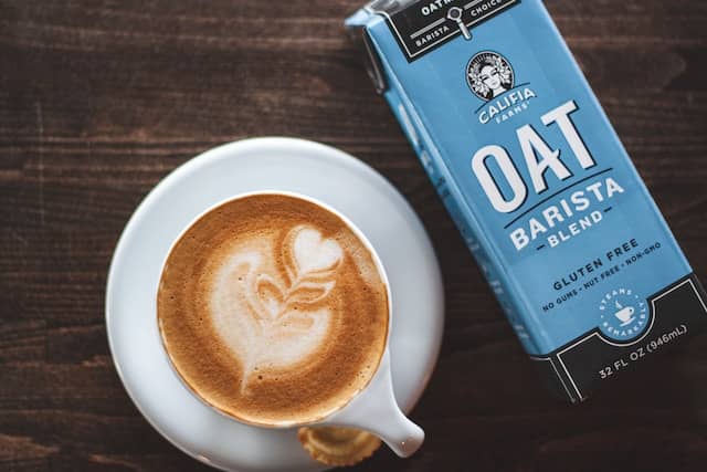 oat milk next to a latte