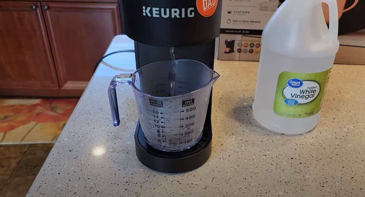 vinegar pouring into cup from keurig